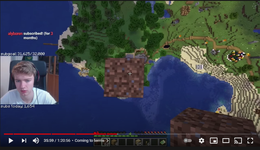 A screenshot from Tommy's stream. He's building a dirt pillar above the remains of Logstedshire. He's fairly high off the ground, probably around 50 blocks or so. His facecam shows he's sad.